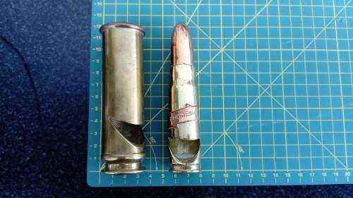Two brass bullet casing bottle openers.