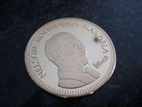 Gold Plated Mandela "Ten Years of Freedom" commemorative token.