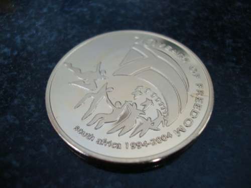 Gold Plated Mandela "Ten Years of Freedom" commemorative token.