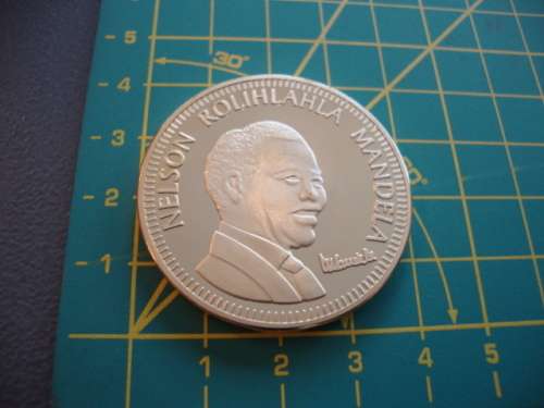 Gold Plated Mandela "Ten Years of Freedom" commemorative token.