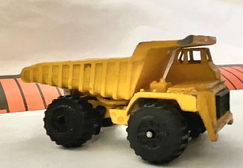 Assorted three toy cars, including a Monster Jam model