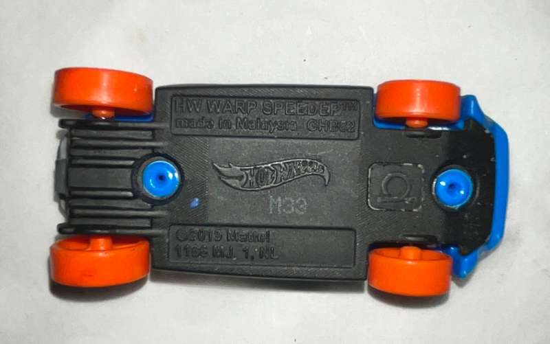 Assorted three toy cars, including a Monster Jam model