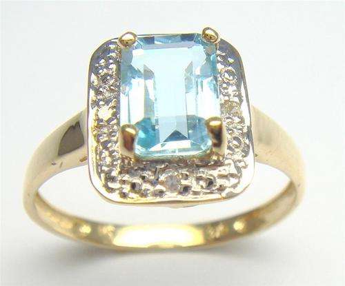 Beautiful solid 9kt gold and genuine blue topaz and diamond ring.