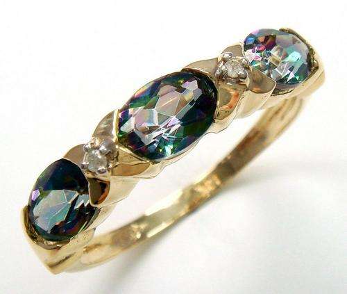 Beautiful solid 9kt gold and genuine mystic topaz and diamond ring.