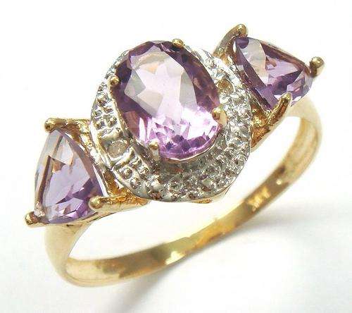 Beautiful solid 10kt gold and genuine amethyst and diamond ring.