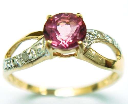 Beautiful solid 10kt gold and genuine pink topaz and diamond ring.