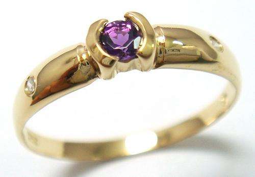 Beautiful solid 9kt gold and genuine amethyst and diamond ring.