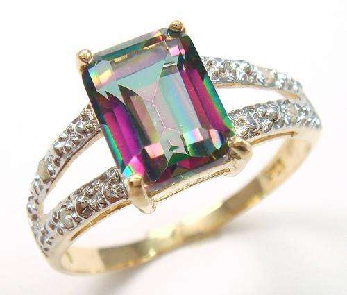 Beautiful solid 9kt gold and genuine mystic topaz and diamond ring.