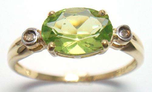 Beautiful solid 9kt gold and genuine peridot and diamond ring.