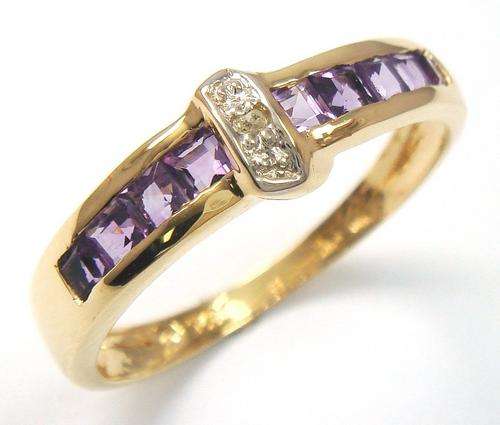 Beautiful solid 9kt gold and genuine smokey amethyst and diamond ring.