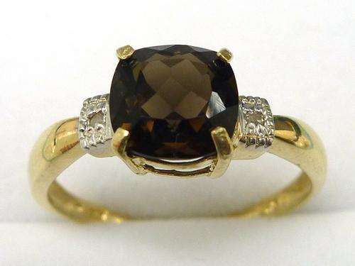 Beautiful solid 9kt gold and genuine smokey topaz and diamond ring.