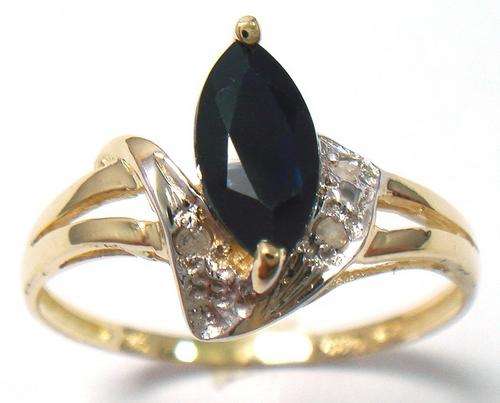 Beautiful solid 9kt gold and genuine black sapphire and diamond ring.