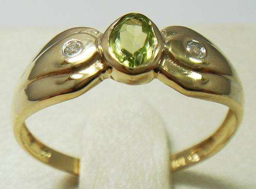 Beautiful solid 9kt gold and genuine peridot and diamond ring.