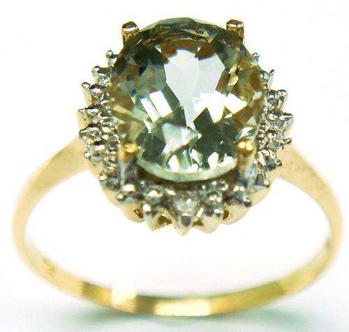 Beautiful solid 9kt gold genuine green amethyst and diamond ring.