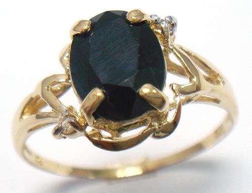 Beautiful solid 9kt gold genuine black sapphire and diamond ring.