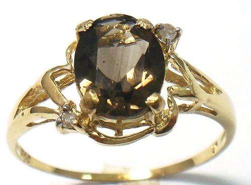 Beautiful solid 9kt gold genuine smokey topaz and diamond ring.