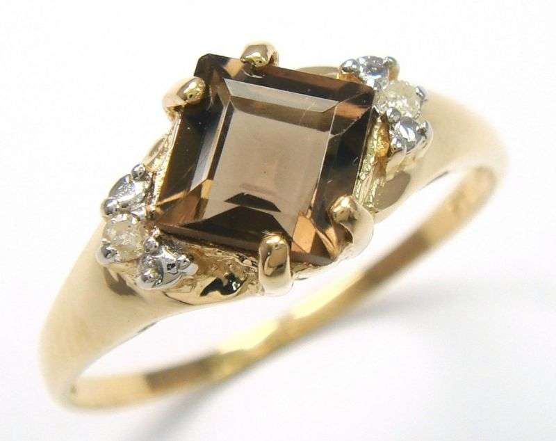 Beautiful solid 10kt gold and genuine smokey topaz and diamond ring.