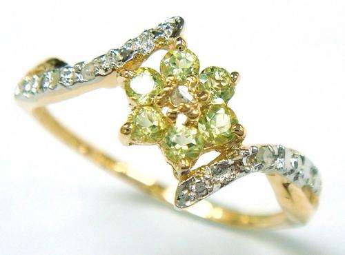 Beautiful solid 10kt gold and genuine peridot and diamond ring.