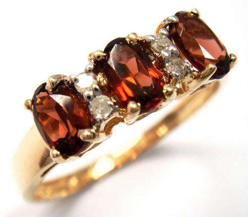 Beautiful solid 9kt gold and genuine garnets and diamond ring.