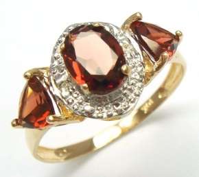 Beautiful solid 10kt gold and genuine garnet and diamonds ring.