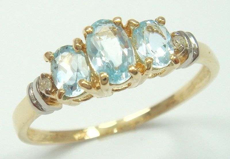 Beautiful solid 10kt gold and genuine topaz and diamond ring.