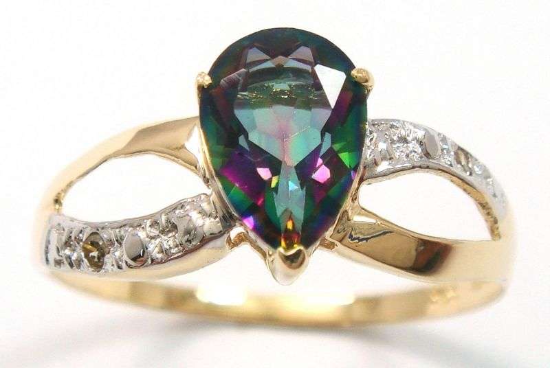 Beautiful solid 10kt gold and genuine mystic topaz and diamond ring.