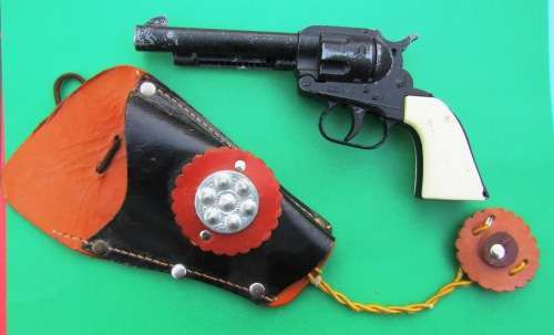 OLD DIE-CAST METAL "COLT" COWBOY CAP GUN WITH LEATHER HOLSTER. MADE IN ENGLAND IN THE SIXTIES.