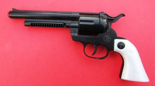 MINT AND BOXED DIE-CAST METAL "GONHER" "COLT" COWBOY CAP GUN . MADE IN SPAIN. FREE ROLLS OF CAPS.