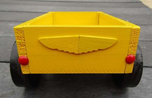 HAND MADE WOODEN TRAILER FOR TRACTOR IN BRIGHT YELLOW. MEDIUM SIZE. VERY STURDY. WOODEN WHEELS.