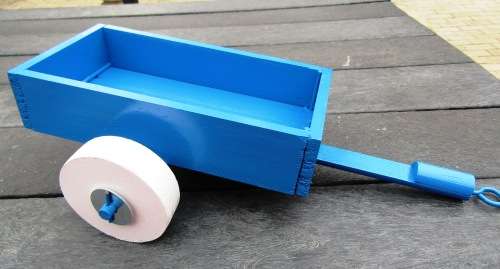 LARGE HAND MADE WOODEN TRAILER FOR TRACTOR IN BRIGHT BLUE. VERY STURDY. WOODEN WHEELS. NOT DINKY.