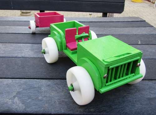 HAND MADE WOODEN `BARBIE` JEEP IN APPLE GREEN WITH TRAILER IN PINK. TOUGH STRUCTURE. NOT DINKY.