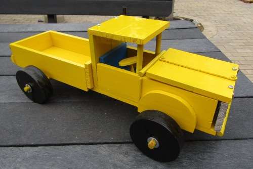 HAND MADE LARGE WOODEN FARM TRUCK IN YELLOW WITH ENGINE AND WOODEN WHEELS. NOT DINKY.