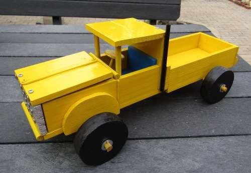HAND MADE LARGE WOODEN FARM TRUCK IN YELLOW WITH ENGINE AND WOODEN WHEELS. NOT DINKY.