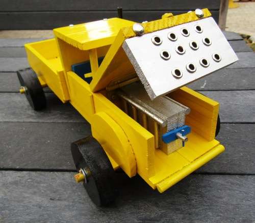 HAND MADE LARGE WOODEN FARM TRUCK IN YELLOW WITH ENGINE AND WOODEN WHEELS. NOT DINKY.