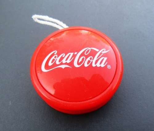 GENUINE `COCA-COLA` YO-YO WITH STRING IN VIBRANT ORANGE COLOR. IN VERY GOOD CONDITION.