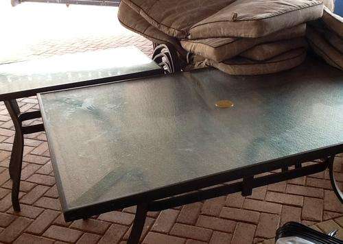 Glass patio set table, side table, 8 chairs and cushions ,need to collect in krugersdorp