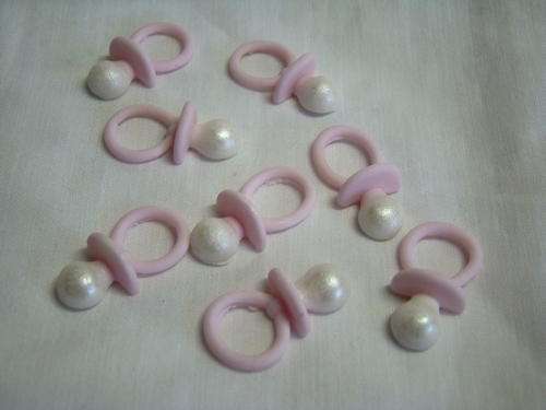 Edible pink baby dummies cake decorations