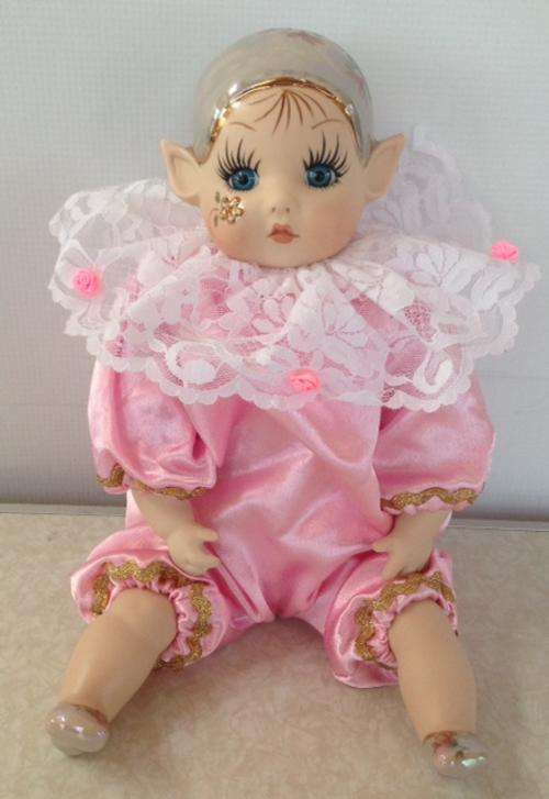 Porcelain Pixie doll dressed in pink coloured suite - Artist 'Loe'