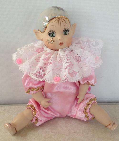 Porcelain Pixie doll dressed in pink coloured suite - Artist 'Loe'