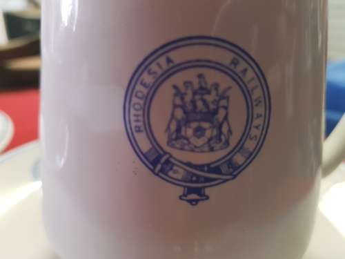 RHODESIA; RHODESIAN RAILWAYS TEA CUP AND SAUCER, MILK JUG AND SIDE PLATE ALL WITH RR BADGE