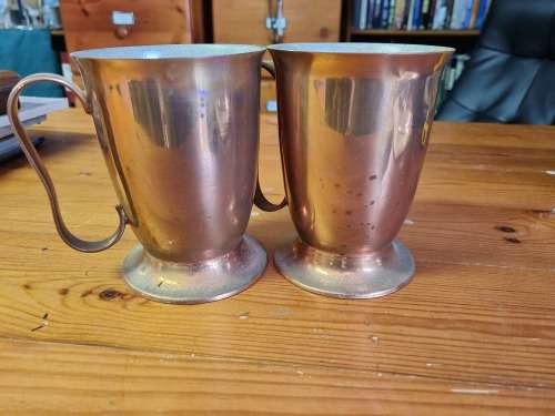 RHODESIA, TWO COPPER BEER MUGS SLIGHTLY MARKED MADE IN RHODESIA