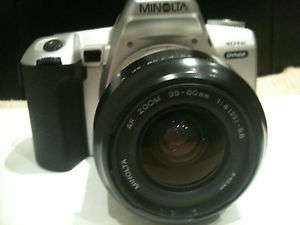 Minolta Dynax 404SI film camera with additional lens