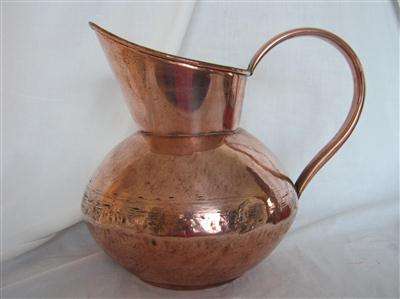 LARGE COPPER JUG...MADE BY DE KLERK OF SOUTH AFRICA...27cm HIGH..74cm AROUND THE GIRTH...