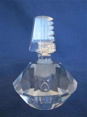 CRYSTAL CUT PERFUME BOTTLE..9cm HIGH..3.50cm ACROSS THE BASE.21cm AROUND THE GIRTH..