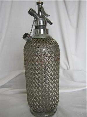 VINTAGE SIPHON... WITH WOVEN STEEL MESH..MADE IN ENGLAND...35cm HIGH X 35cm AROUND THE GIRTH...