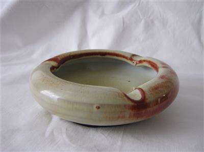 CREAM & BROWN POTTERY ASHTRAY...14cm ACROSS...