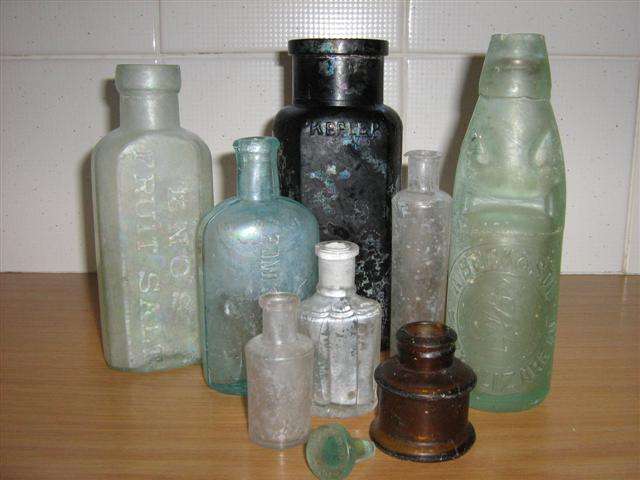 LOT OF 8 ANTIQUE / RECOVERED GLASS BOTTLES,WITH A GLASS STOPPER MARKED HOLBROOK & CO