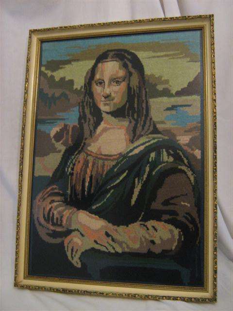 FRAMED TAPESTRY OF " THE MONA LISA " BEHIND NON-REFLECTIVE GLASS
