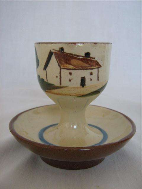 MOTTO WARE EGG CUP..8cm HIGH X 8.50cm ACROSS THE BASE...