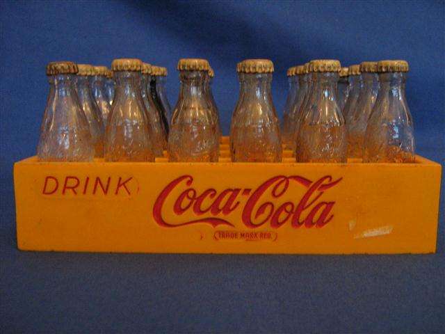 MINATURE COCA-COLA BOTTLES IN MATCHING PLASTIC CASE...